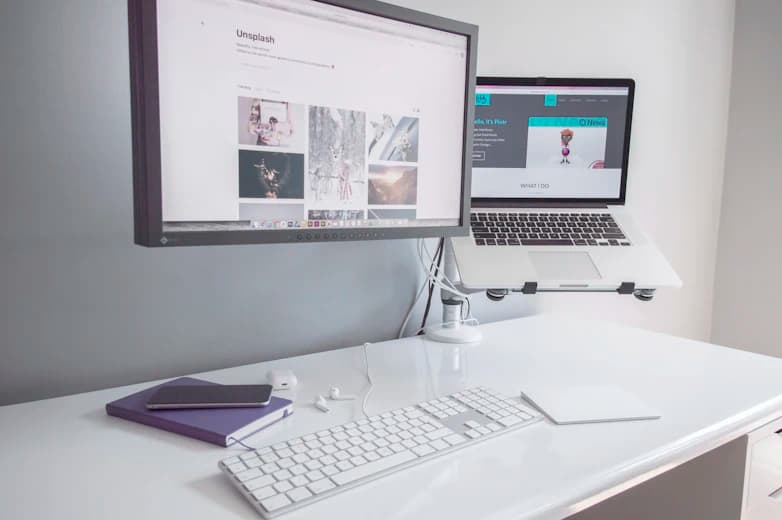 Desk with laptop showing reports